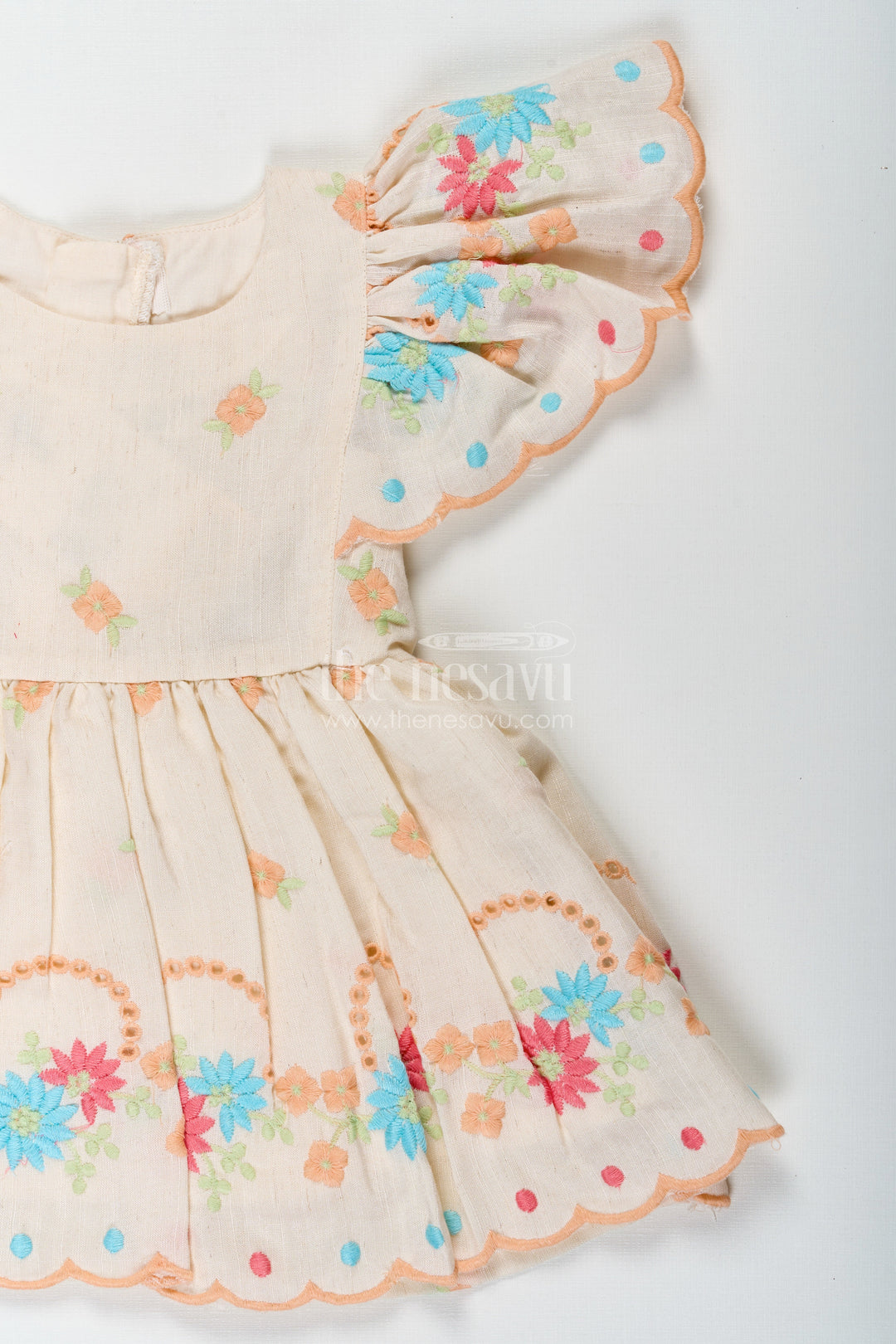 The Nesavu Baby Cotton Frocks Frock Baby in Cream Cotton with Multicolor Thread Embroidery and Angel Sleeves Nesavu Frock Baby Cream Cotton Multicolor Thread Embroidery Angel Sleeves | The Nesavu