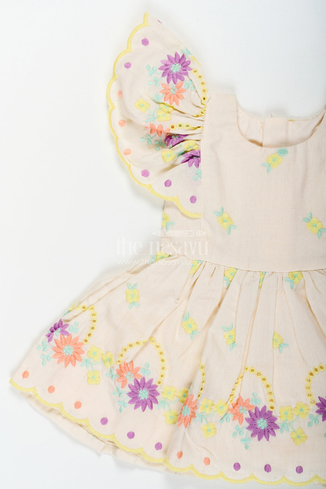 The Nesavu Baby Cotton Frocks Frock Party Wear for Baby Girls in Cotton with Vibrant Thread Embroidery and Butterfly Sleeves Nesavu Frock Party Wear Baby Girls Cream Cotton Floral Thread Embroidery | The Nesavu