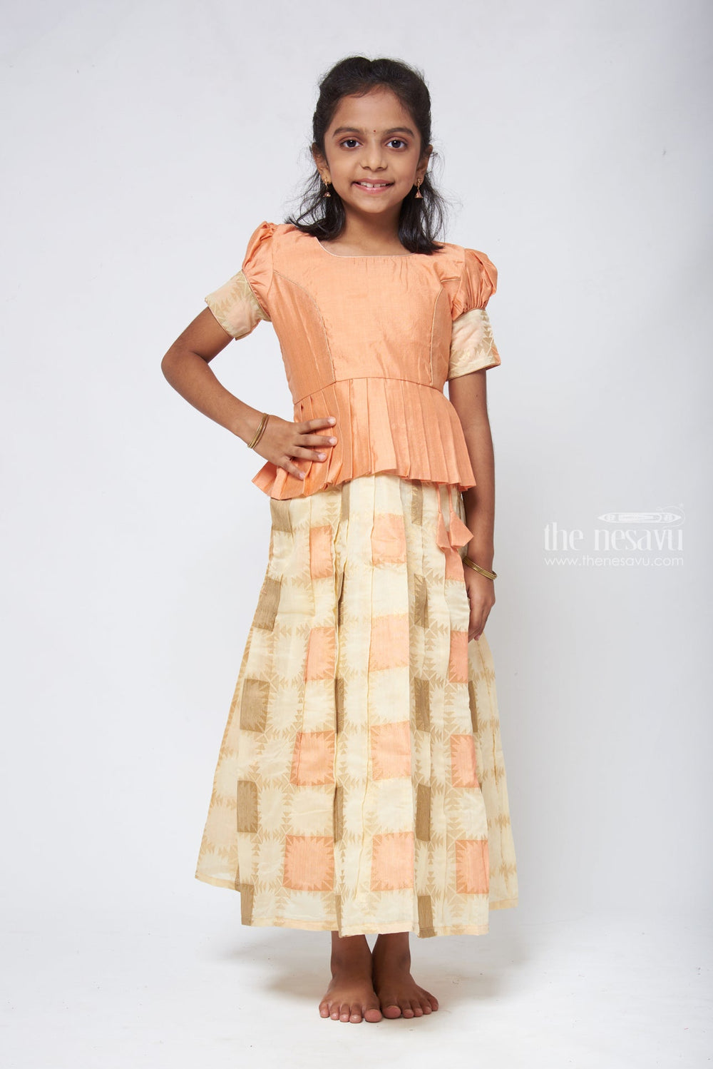 The Nesavu Pattu Pavadai Geometrical Designer Pleated Skirt and Orange Jacquard Silk Blouse Nesavu Pattu Pavadai New Design | Girls Traditional Dress | The Nesavu