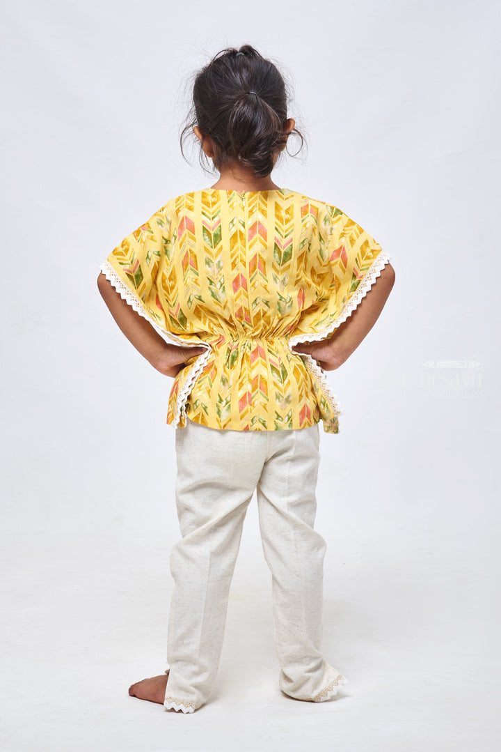 The Nesavu Girls Sharara / Plazo Set Geometrical & Foil Printed Yellow Kaftan Top & Half White Pant: Trendy Fusion for Girls Nesavu Geometric Printed Dreeses for Girls | Kaftan Top With Straight Pant | the Nesavu