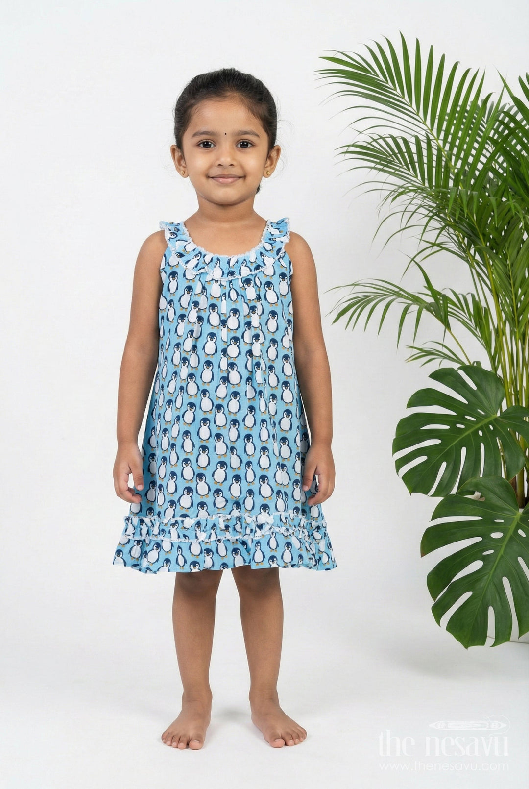 The Nesavu Girls Cotton Frock Girls Affordable Cotton Frock with Blue Penguin Hand Block Print and Frill Accents for Comfortable Wear Nesavu 18 (2Y) / Blue GFC1796A-18 Nesavu Blue Hand Block Printed Affordable Cotton Frock Girls Penguin Motif Ruffle Details