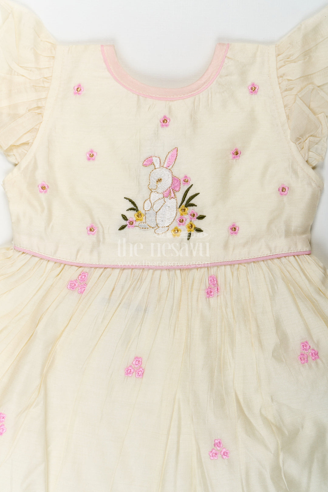 The Nesavu Girls Chanderi Frock Girls Animal Print Ruffle Dress in Chanderi with Thread Embroidery and Pink Floral Accents Nesavu Girls Animal Print Ruffle Dress Chanderi Bunny Motif Floral Embroidery | The Nesavu