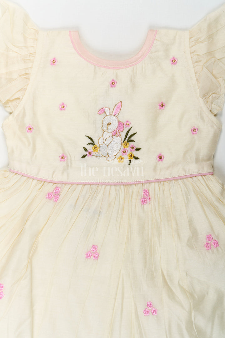 The Nesavu Girls Chanderi Frock Girls Animal Print Ruffle Dress in Chanderi with Thread Embroidery and Pink Floral Accents Nesavu Girls Animal Print Ruffle Dress Chanderi Bunny Motif Floral Embroidery | The Nesavu