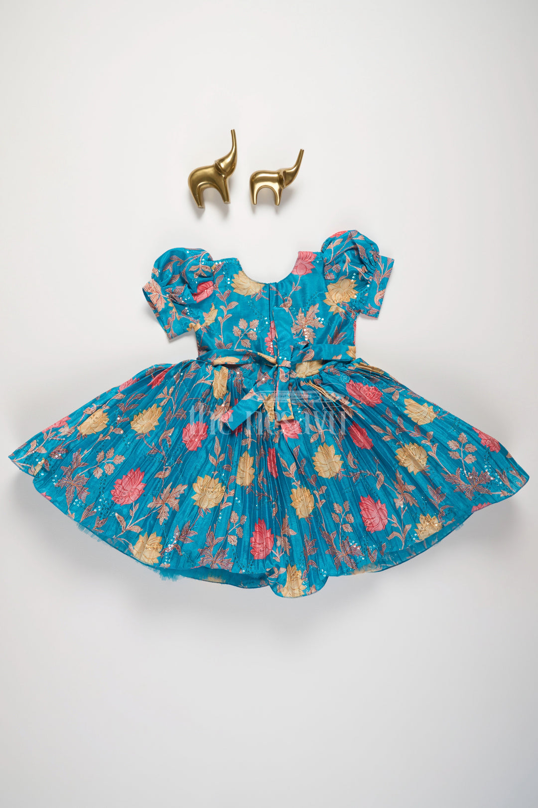 The Nesavu Silk Party Frock Girls Blue Floral Silk Party Frock with Puff Sleeves and Embellished Waistline Nesavu Nesavu Teal Floral Silk Party Frock Puff Sleeves Pleated Skirt Girls