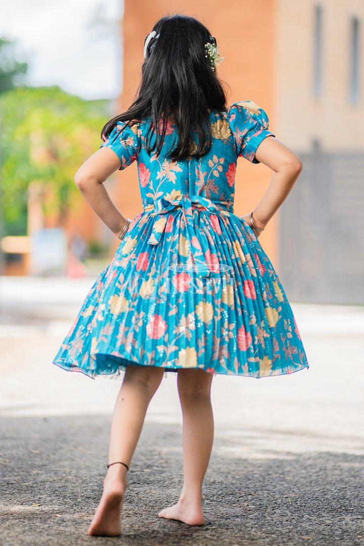 The Nesavu Silk Party Frock Girls Blue Floral Silk Party Frock with Puff Sleeves and Embellished Waistline Nesavu Nesavu Teal Floral Silk Party Frock Puff Sleeves Pleated Skirt Girls