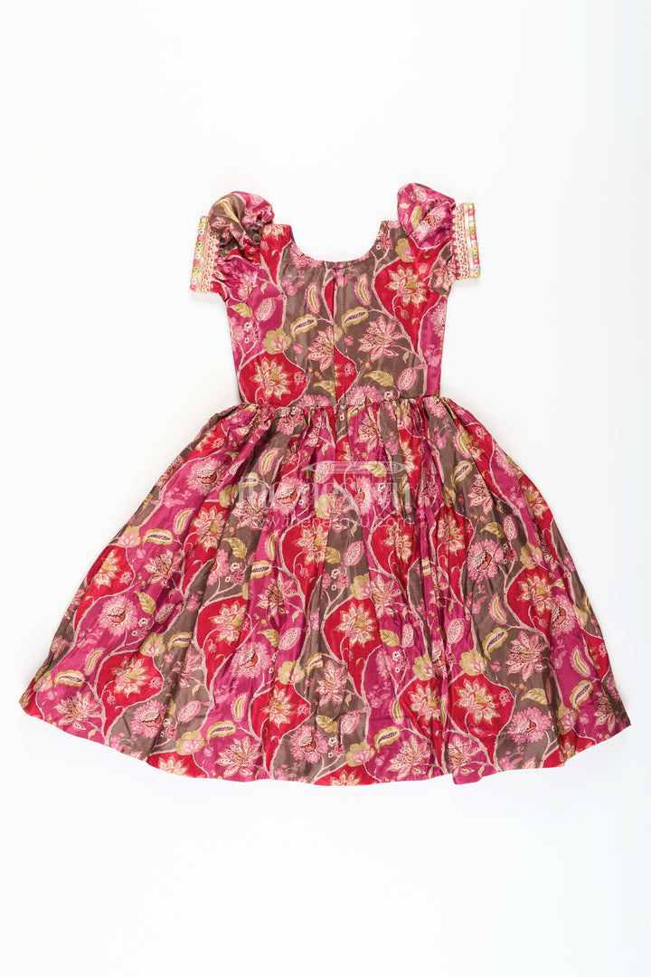 The Nesavu Girls Silk Gown Girls Bride in Wedding Dress Style Chinon Silk Gown with Intricate Mirror Work and Rich Floral Pattern Nesavu Girls Bride Wedding Dress Inspired Chinon Silk Gown Mirror Embellishment Floral Print | The Nesavu