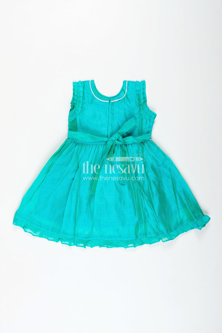 The Nesavu Girls Chanderi Frock Girls Chanderi Cotton Frock with Peacock Embroidery and Ruffled Sleeves for Elegant Occasions Nesavu Girls Chanderi Cotton Frock Peacock Embroidery Ruffled Sleeves Festive Wear | The Nesavu