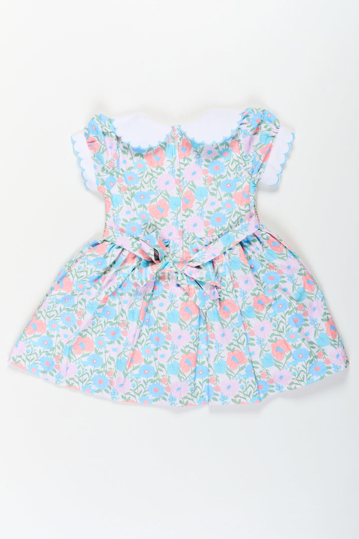 The Nesavu Girls Cotton Frock Girls Collar Frock Design in Floral Cotton with Smocked Bodice and Embroidered Collar for a Playful Yet Polished Look Nesavu Girls Floral Cotton Collar Frock Design Smocking Embroidered Peter Pan Collar | The Nesavu