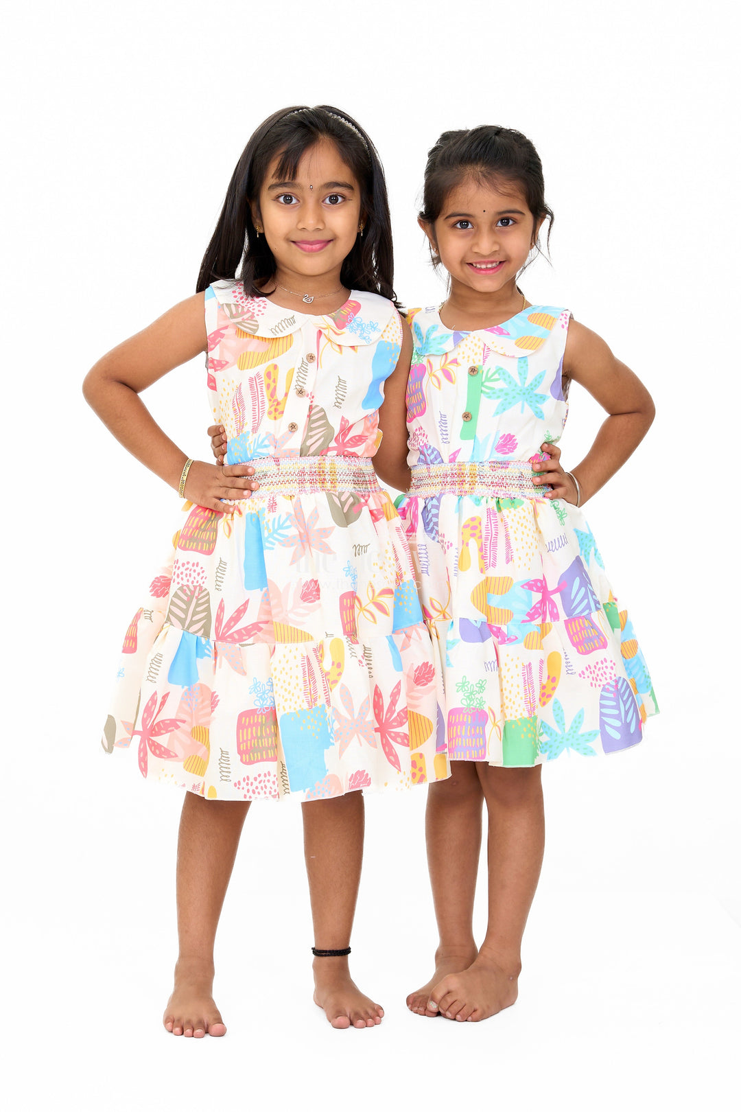The Nesavu Girls Cotton Frock Girls Cotton a-Line Frock with Multicolor Prints and Smocked Waist Nesavu Girls Cotton A-Line Frock Multicolor Prints Tiered Skirt | The Nesavu