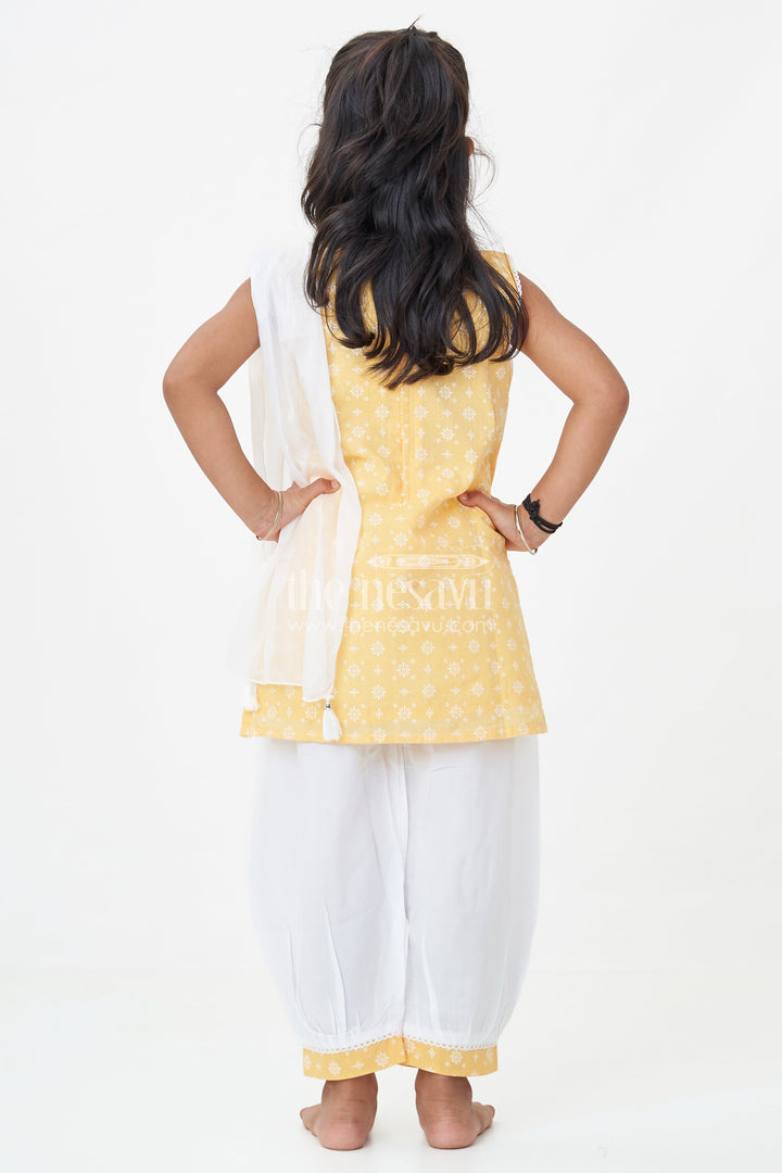 The Nesavu Girls Churidar Sets Girls Cotton Latest Chudi Set in Yellow with Stone Embellishment and Contrasting Dhoti Bottoms Nesavu Girls Yellow Cotton Chudi Set Embroidered Top White Dhoti Pants Ethnic Look | The Nesavu