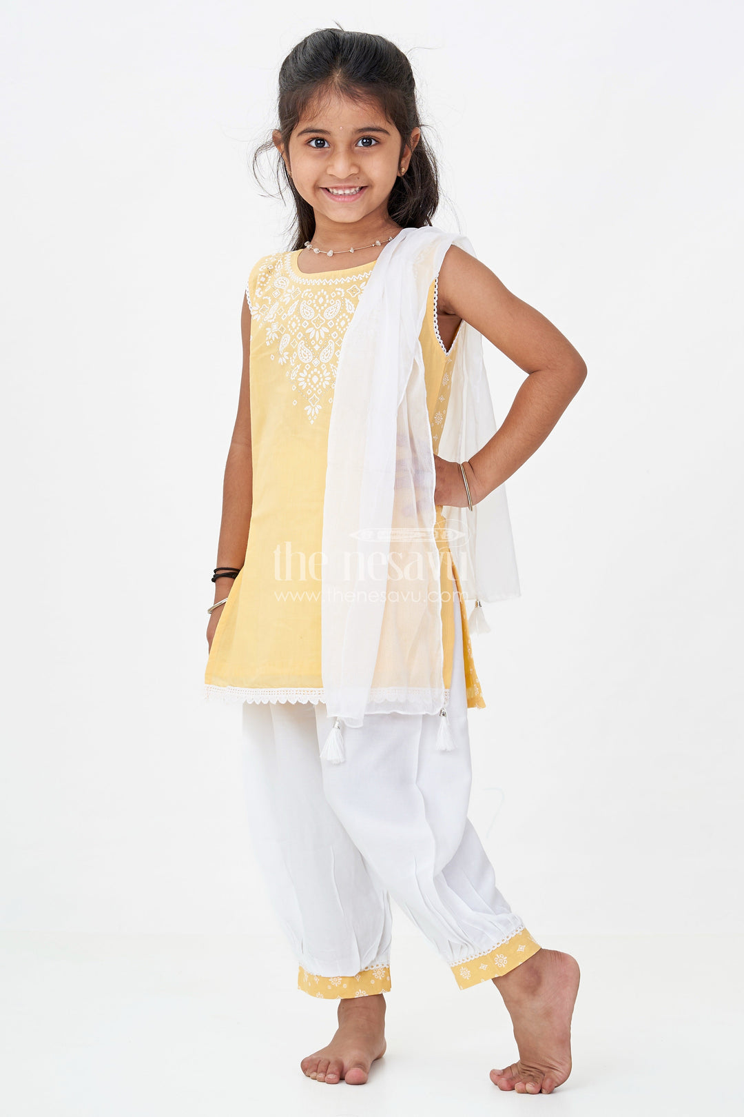 The Nesavu Girls Churidar Sets Girls Cotton Latest Chudi Set in Yellow with Stone Embellishment and Contrasting Dhoti Bottoms Nesavu Girls Yellow Cotton Chudi Set Embroidered Top White Dhoti Pants Ethnic Look | The Nesavu