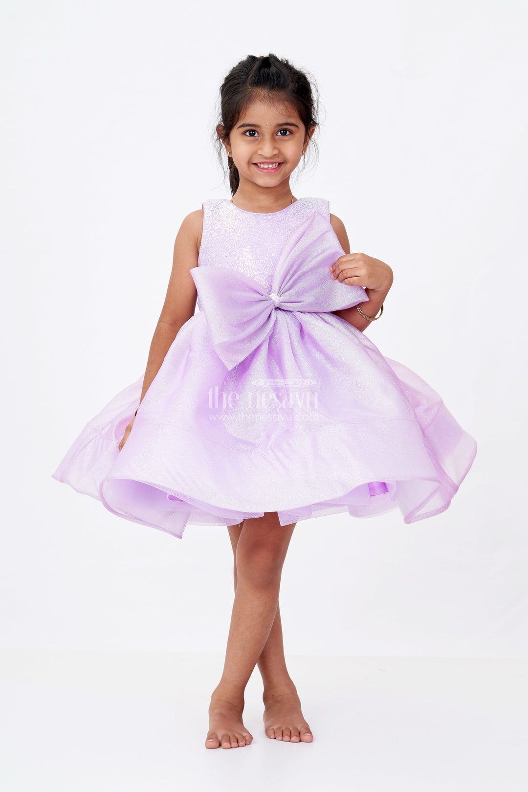 The Nesavu Girls Fancy Party Frock Girls Cotton Party Wear Frock in Lavender Organza with Giant Bow and Glittery Flared Silhouette Nesavu 16 (1Y) / Purple PF201C-16 Girls Cotton Party Wear Frock Lavender Organza Glitter Finish Oversized Bow | The Nesavu