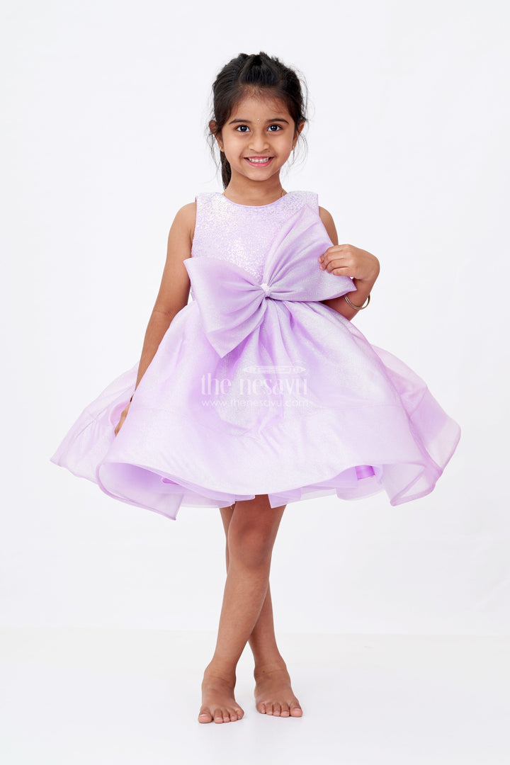 The Nesavu Girls Fancy Party Frock Girls Cotton Party Wear Frock in Lavender Organza with Giant Bow and Glittery Flared Silhouette Nesavu 16 (1Y) / Purple PF201C-16 Girls Cotton Party Wear Frock Lavender Organza Glitter Finish Oversized Bow | The Nesavu
