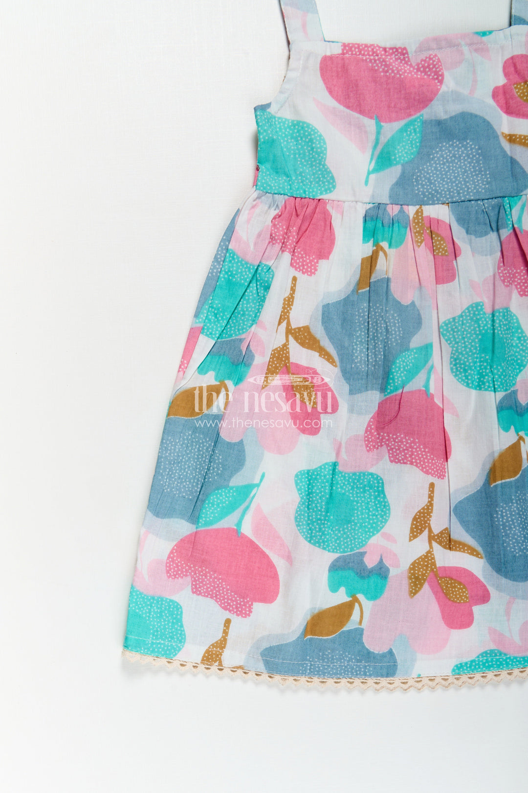 The Nesavu Girls Cotton Frock Girls Cotton Short Frock Party Wear in Sleeveless Style with Bold Floral Print On Pastel Base Nesavu Short Frock Party Wear Sleeveless Cotton Bold Floral Print Pleated Design | The Nesavu