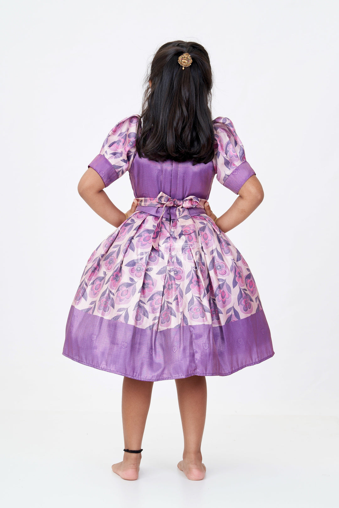 The Nesavu Silk Frock Girls Cotton Silk Frock in Rich Purple Jacquard with Floral Border and Embellished Neckline Nesavu Girls Cotton Silk Frock Purple Jacquard Floral Print Border Embellished Neckline | The Nesavu