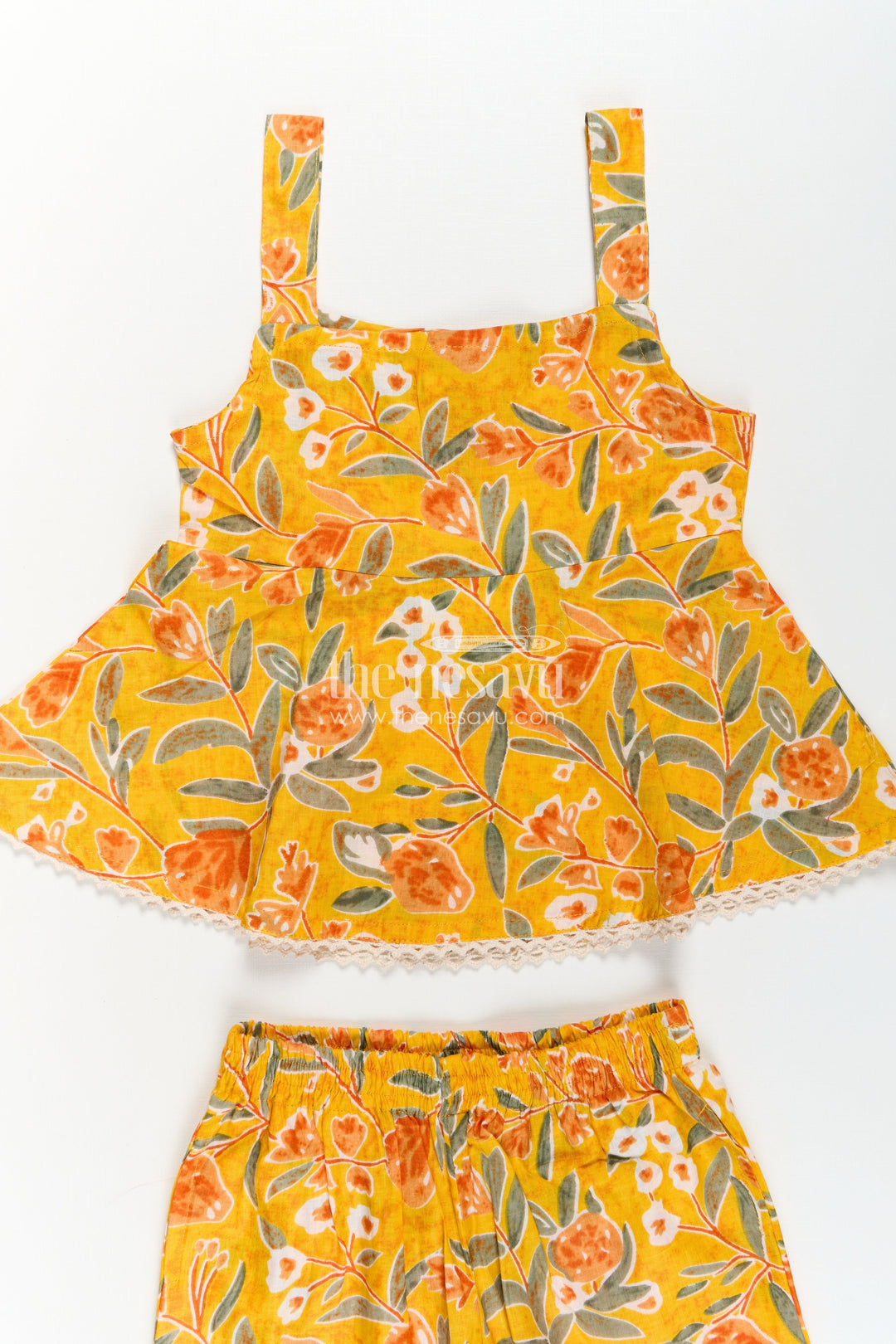 The Nesavu Girls Casual Set Girls Cotton Sleeveless Dresses Inspired Set in Mustard with Orange and Green Floral Prints Nesavu Sleeveless Dresses Inspired Girls Cotton Set Mustard Floral Print Flared Top | The Nesavu