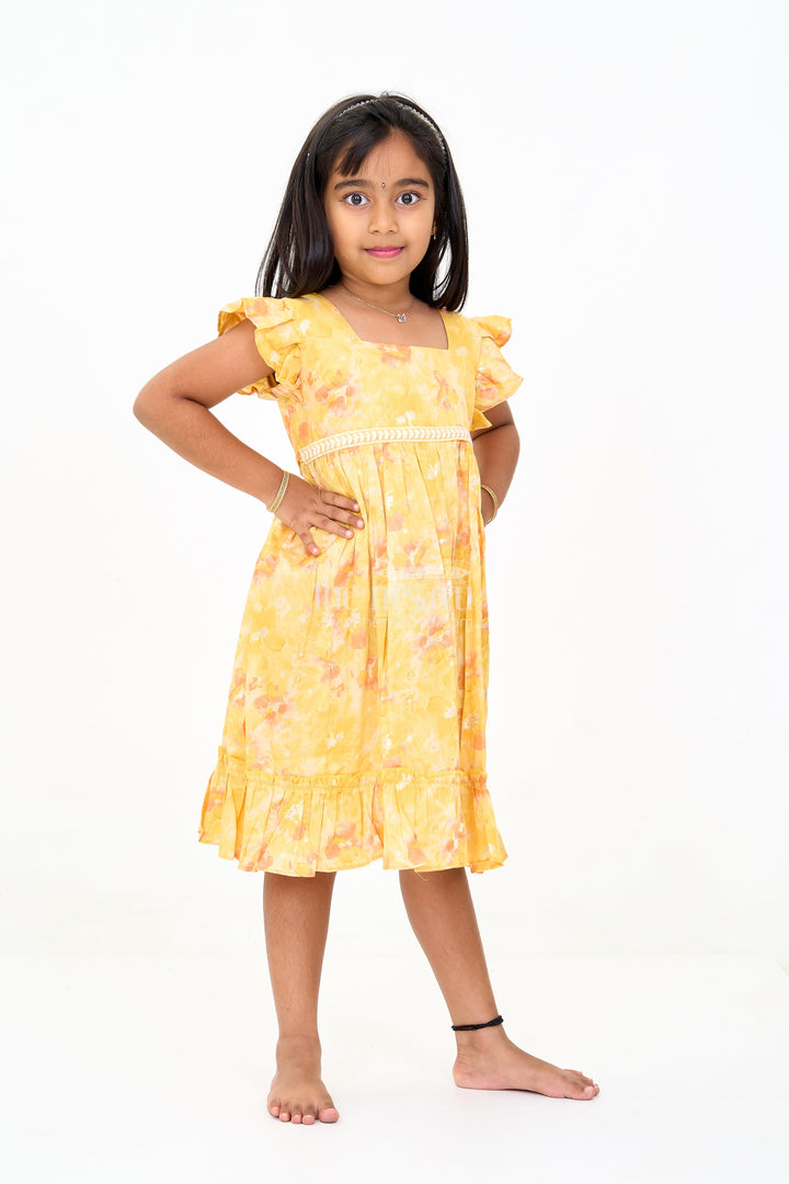 The Nesavu Girls Cotton Frock Girls Cotton Summer Dress for Babies with Yellow and Orange Floral Prints Nesavu Girls Cotton Summer Dress Babies Floral Prints Ruffled Hem | The Nesavu