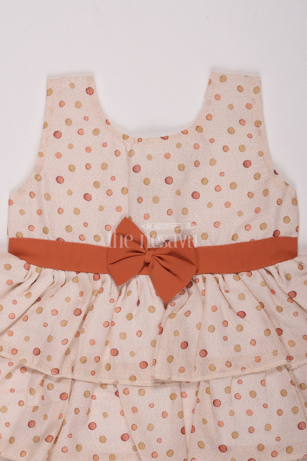 The Nesavu Baby Cotton Frocks Girls Cream Brasso Polka Dot Dress with Rust Bow and Layered Skirt for Festive Gatherings Nesavu Nesavu Girls Cream Brasso Dress Gold Polka Dots Layered Skirt Festive Events