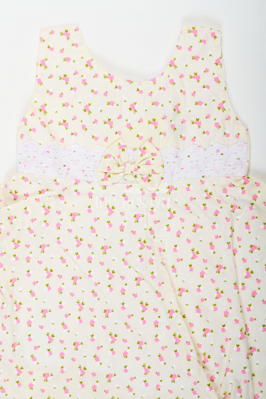 The Nesavu Baby Cotton Frocks Girls Cream Soft Cotton Dresses Online with Allover Floral Print and Lace Bow Waist Detail Nesavu Soft Cotton Dresses Online Girls Allover Floral Print Lace Waist Bow Detail | The Nesavu