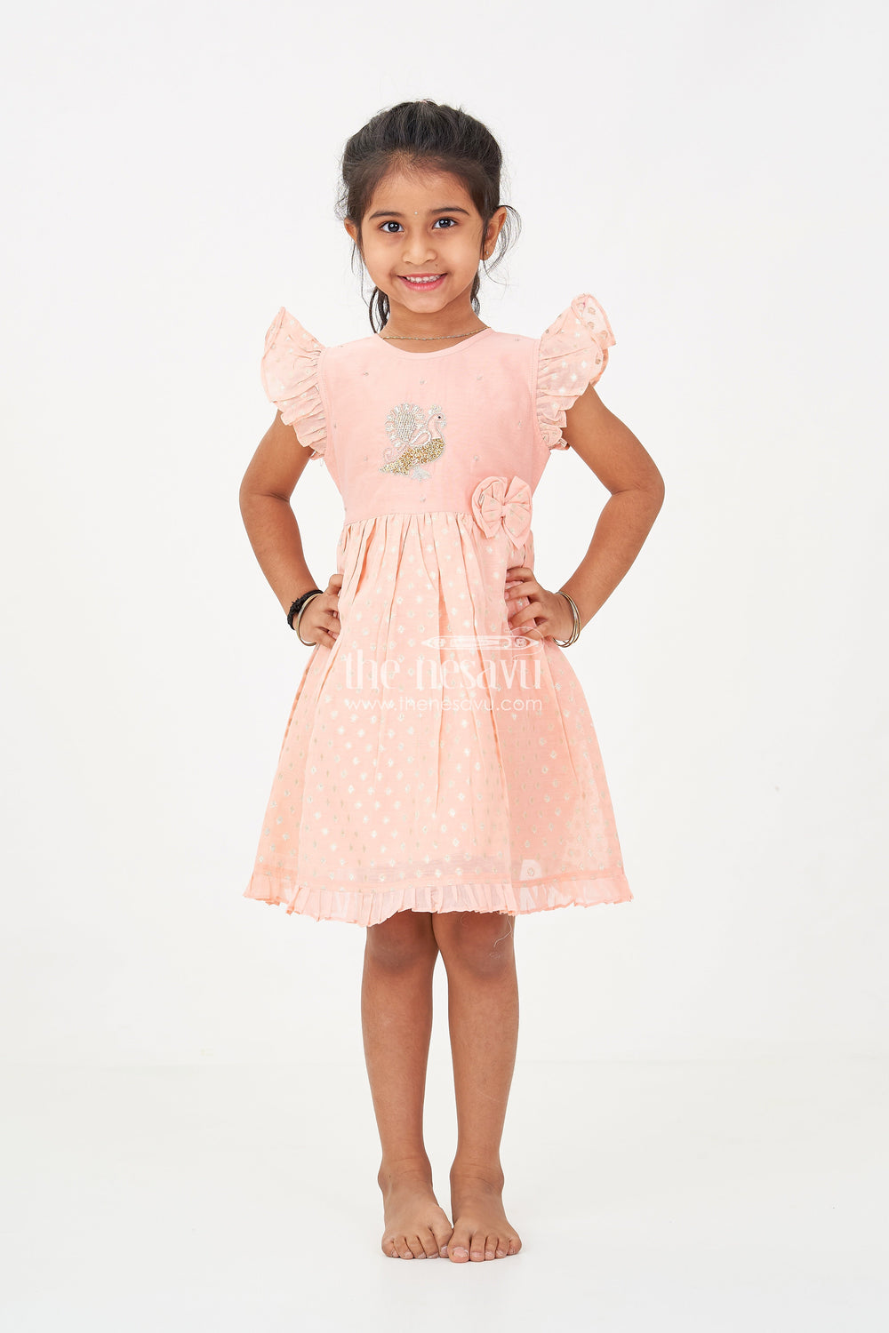 The Nesavu Girls Chanderi Frock Girls dark peach colour frock in Chanderi with Thread Embroidered Peacock and Frilled Hem Design Nesavu Nesavu Girls dark peach colour frock Chanderi Peacock Embroidery Gold Motif Detailing