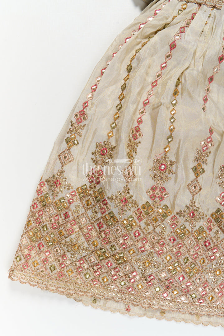 The Nesavu Girls Silk Gown Girls Designer Anarkali in Ivory Shimmer Silk with Embroidered Jacket and Pleated Skirt Finish Nesavu Ivory Designer Anarkali Gown Girls Shimmer Silk Embroidered Jacket Flared Skirt | The Nesavu