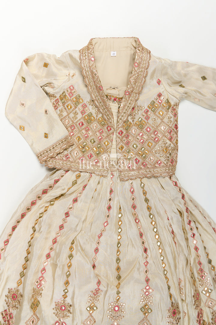 The Nesavu Girls Silk Gown Girls Designer Anarkali in Ivory Shimmer Silk with Embroidered Jacket and Pleated Skirt Finish Nesavu Ivory Designer Anarkali Gown Girls Shimmer Silk Embroidered Jacket Flared Skirt | The Nesavu