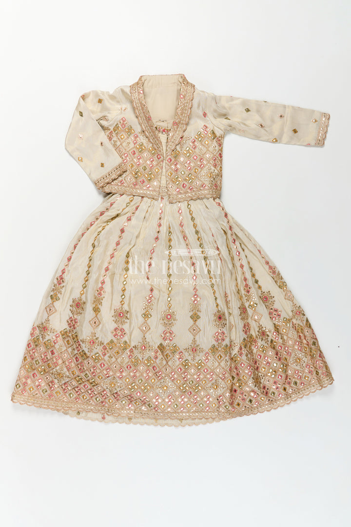 The Nesavu Girls Silk Gown Girls Designer Anarkali in Ivory Shimmer Silk with Embroidered Jacket and Pleated Skirt Finish Nesavu Ivory Designer Anarkali Gown Girls Shimmer Silk Embroidered Jacket Flared Skirt | The Nesavu