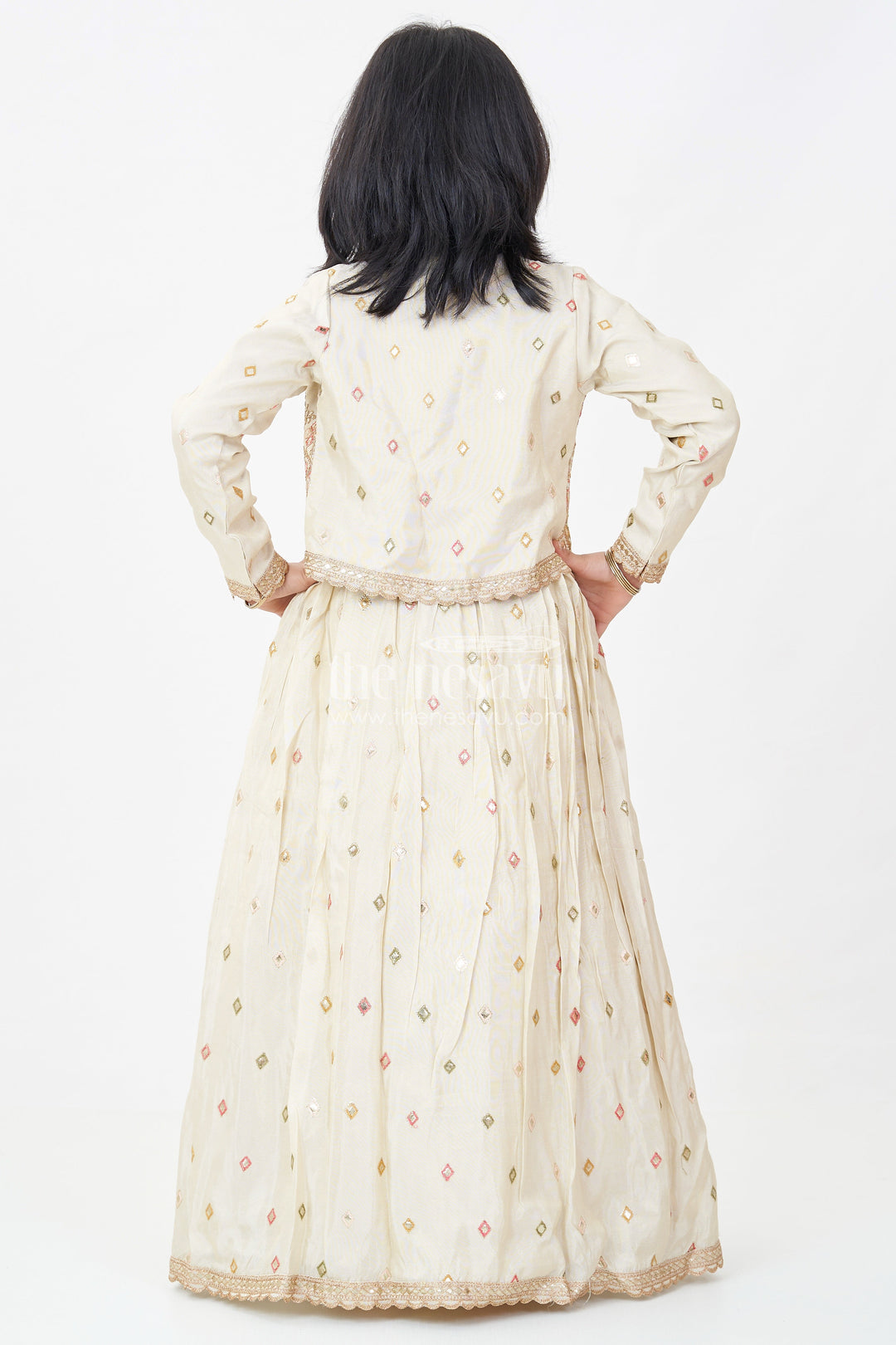 The Nesavu Girls Silk Gown Girls Designer Anarkali in Ivory Shimmer Silk with Embroidered Jacket and Pleated Skirt Finish Nesavu Ivory Designer Anarkali Gown Girls Shimmer Silk Embroidered Jacket Flared Skirt | The Nesavu