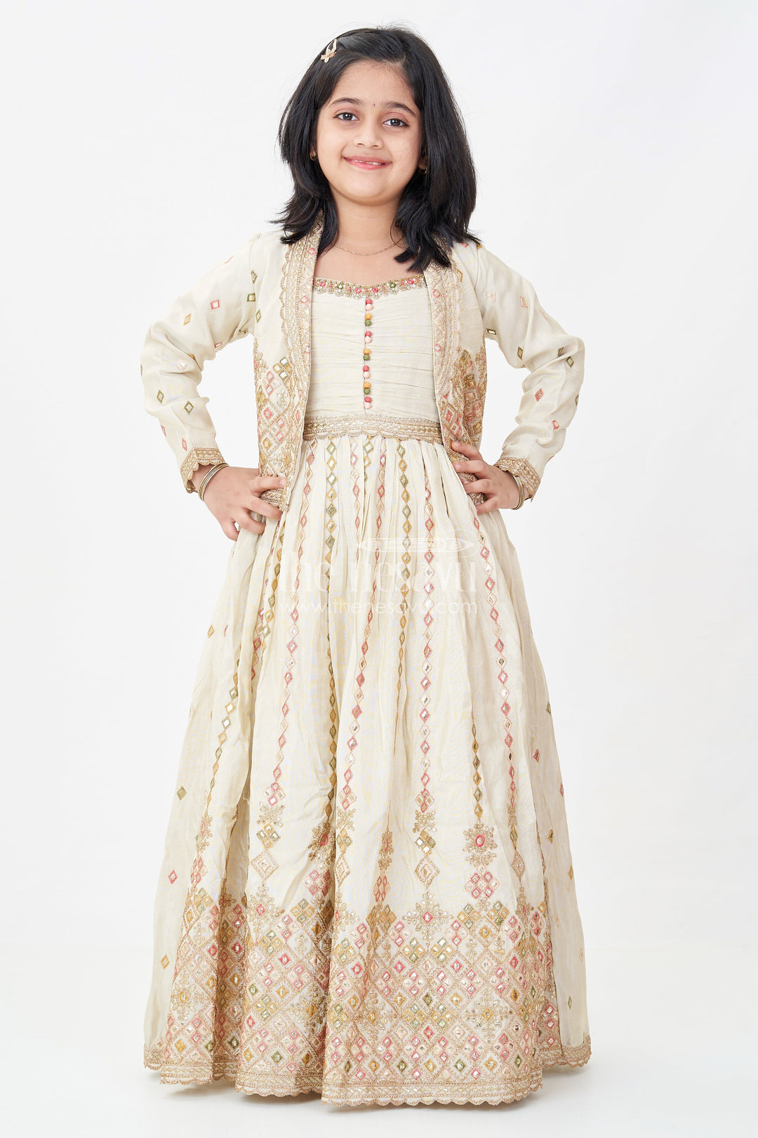 The Nesavu Girls Silk Gown Girls Designer Anarkali in Ivory Shimmer Silk with Embroidered Jacket and Pleated Skirt Finish Nesavu Ivory Designer Anarkali Gown Girls Shimmer Silk Embroidered Jacket Flared Skirt | The Nesavu