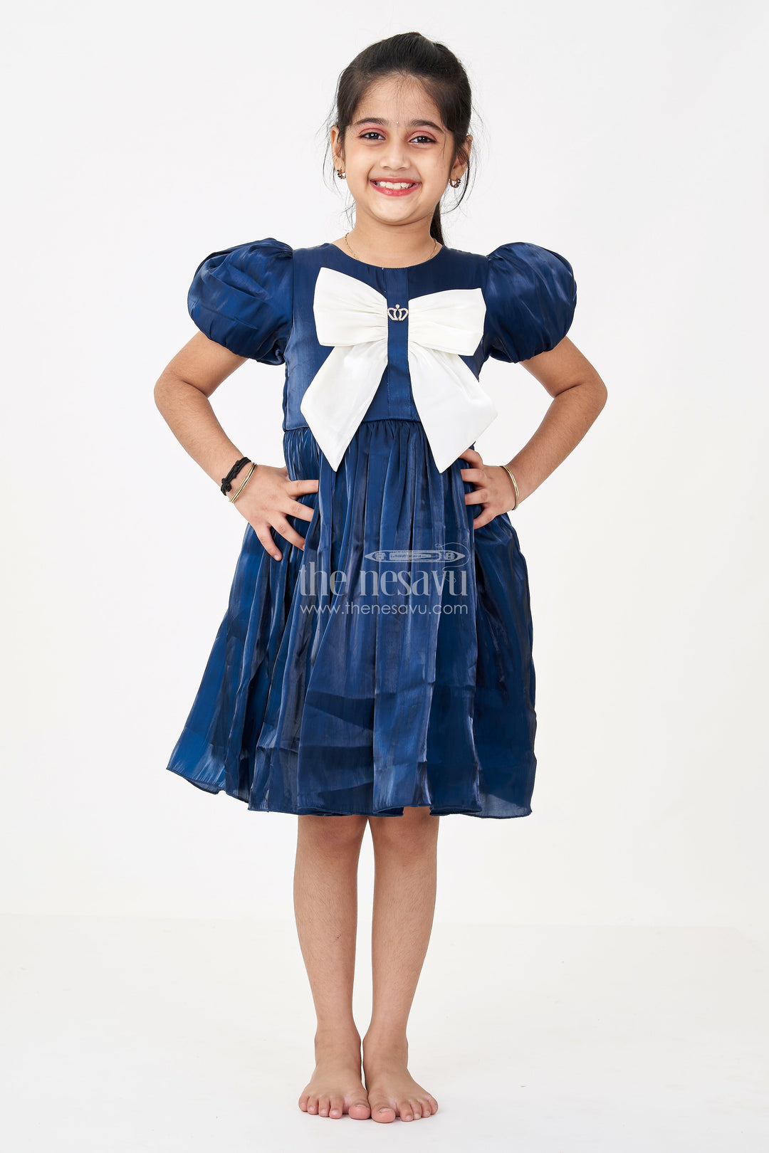 The Nesavu Girls Fancy Frock Girls Disney Princess Frock in Navy Blue Satin with Puff Sleeves and Large Ivory Bow Embellishment Nesavu Girls Disney Princess Frock Satin Puff Sleeves Royal Bow Embellishment | The Nesavu
