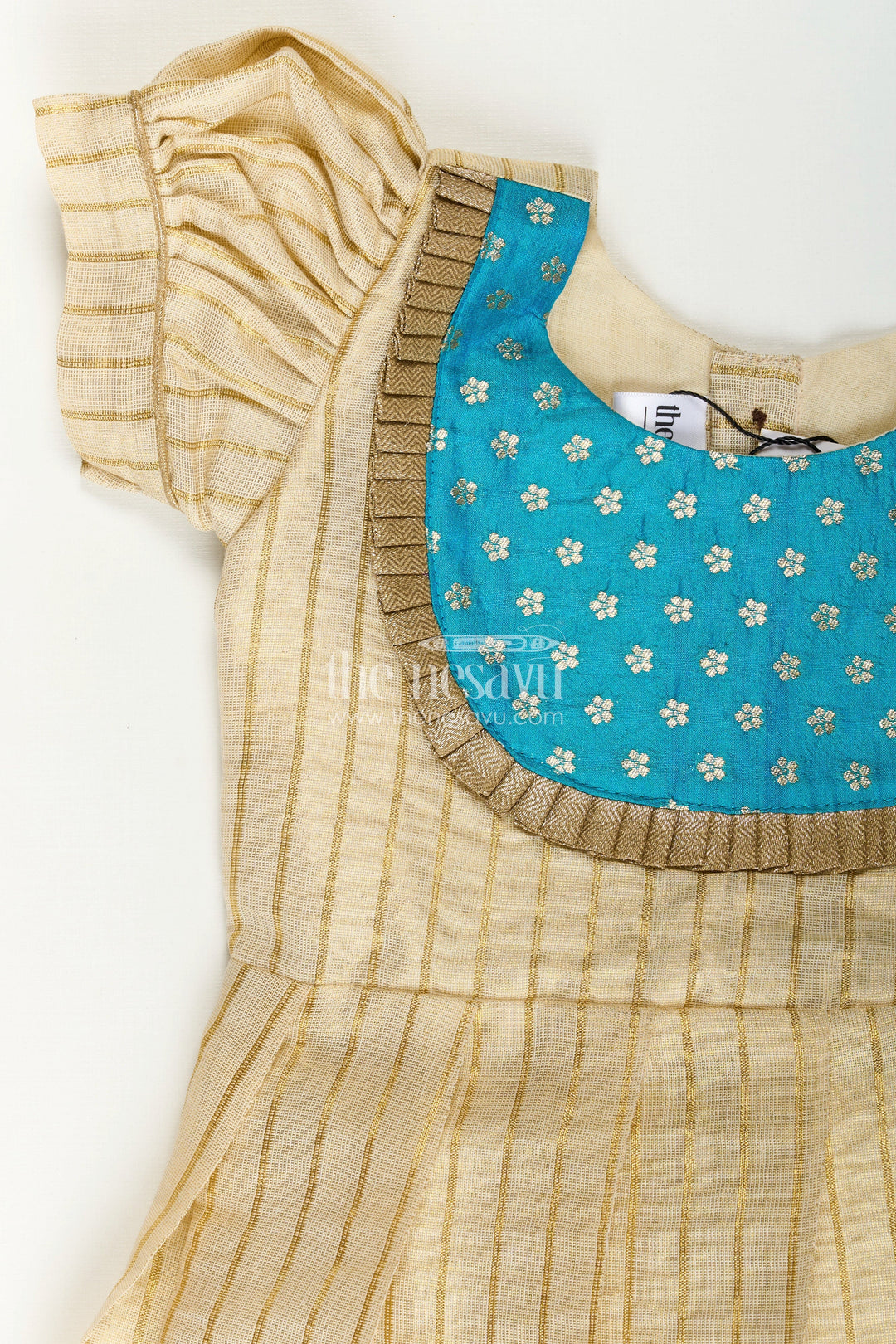 The Nesavu Silk Frock Girls Ethnic Long Frocks in Beige Silk with Blue Banaras Yoke and Structured Pleats Nesavu Nesavu Ethnic Long Frocks Girls Beige Silk Blue Banaras Yoke Traditional Pleats