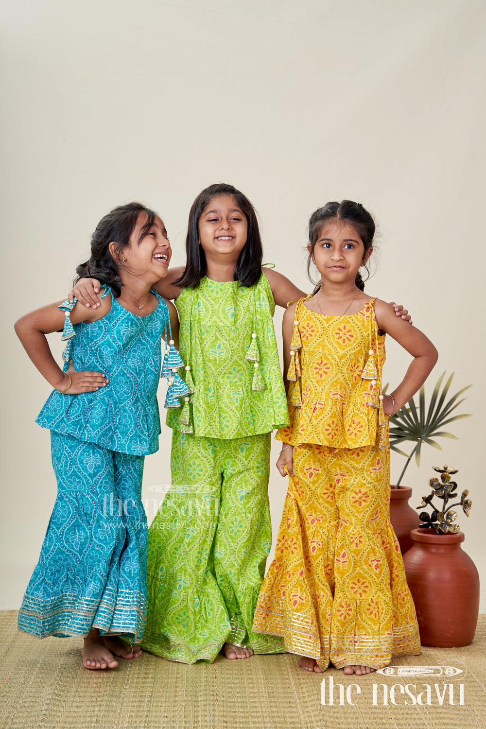 The Nesavu Girls Casual Set Girls Ethnic Sharara Set with Yellow Floral Prints for Festivals Nesavu Nesavu Girls Yellow Ethnic Cotton Sharara Set Patik Digital Print Halter Top