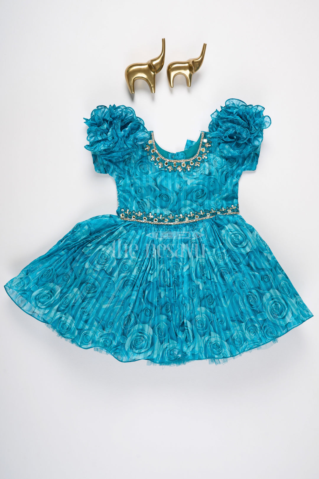 The Nesavu Silk Party Frock Girls Fancy Frock in Blue Organza Printed Fabric with Puff Sleeves and Floral Embellishments Nesavu Nesavu Girls Fancy Frock Teal Blue Puff Sleeves Floral Embellishments Organza