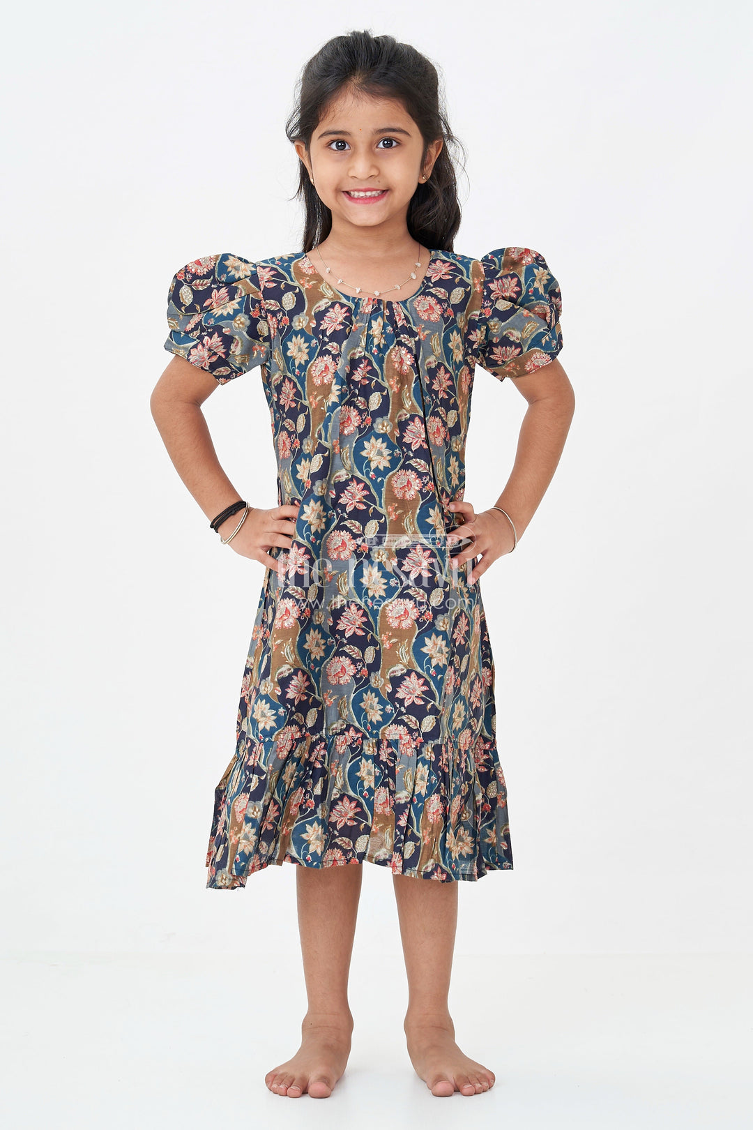 The Nesavu Girls Fancy Frock Girls Floral Frock Pattern Top in Blue Modal Silk with Ruffle Hem and Puff Sleeves for All-Day Style Nesavu Nesavu Girls Blue Floral Modal Silk Frock Pattern Top Puff Sleeves Ruffle Hemline