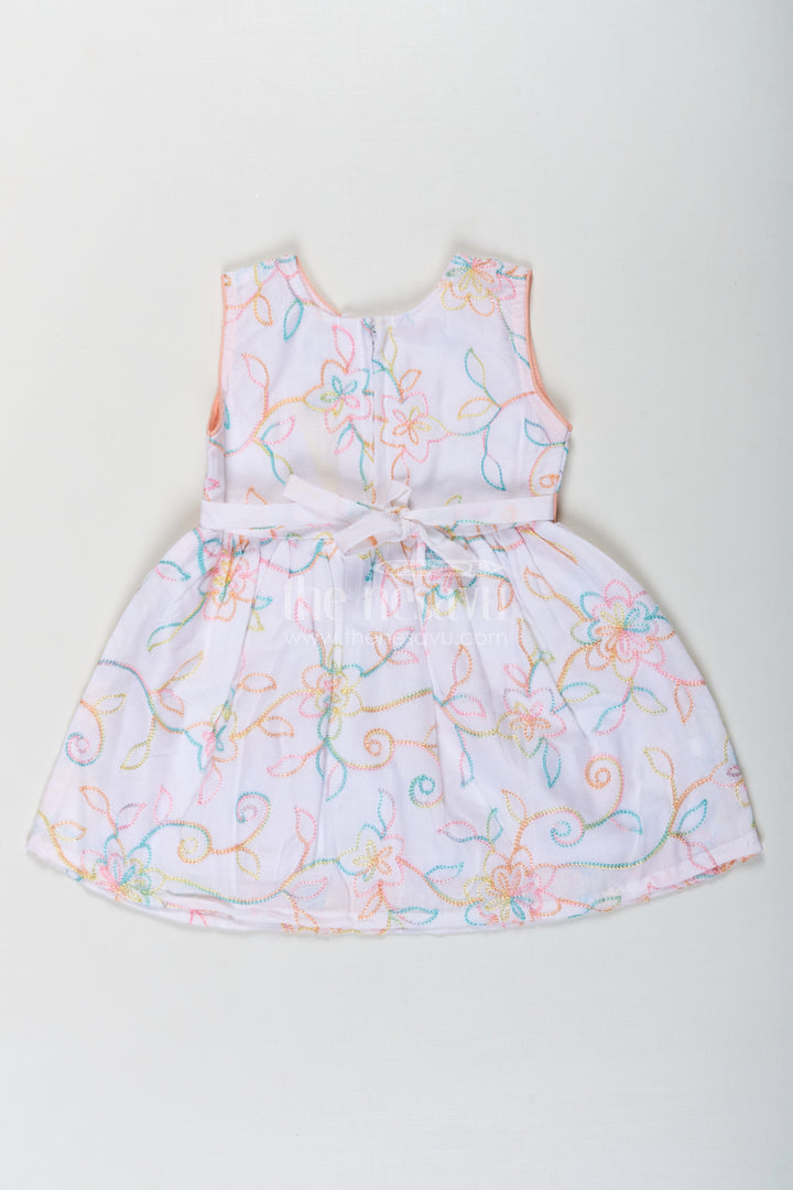 The Nesavu Baby Cotton Frocks Girls Flower White Dress in Cotton with Multicolor Floral Embroidery and Peach Waist Bow Nesavu Flower White Dress Girls Embroidered Cotton Multicolor Floral Patterns Bow Accent | The Nesavu