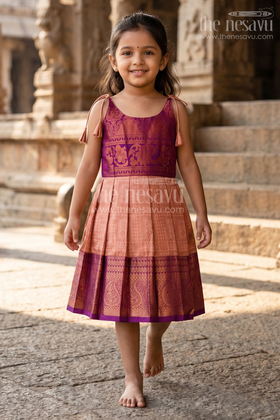 The Nesavu Tie-up Frock Girls Gold Silk Dress in Semi Kanchivaram with Purple Zari Bodice and Pleated Tie Up Tassel Frock Nesavu Gold Silk Dress for Girls in Semi Kanchivaram with Purple Zari Weave and Tassel Tie Up Straps | The Nesavu