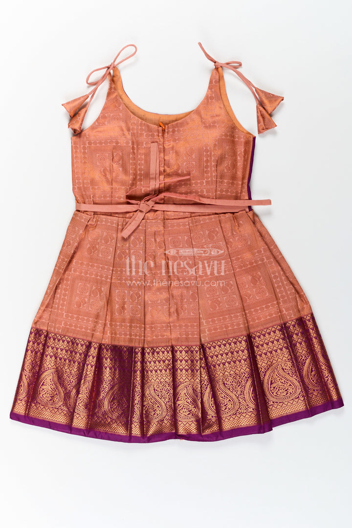 The Nesavu Tie Up Frock Girls Gold Silk Dress in Semi Kanchivaram with Purple Zari Bodice and Pleated Tie Up Tassel Frock Nesavu Nesavu Gold Silk Dress for Girls in Semi Kanchivaram with Purple Zari Weave and Tassel Tie Up Straps