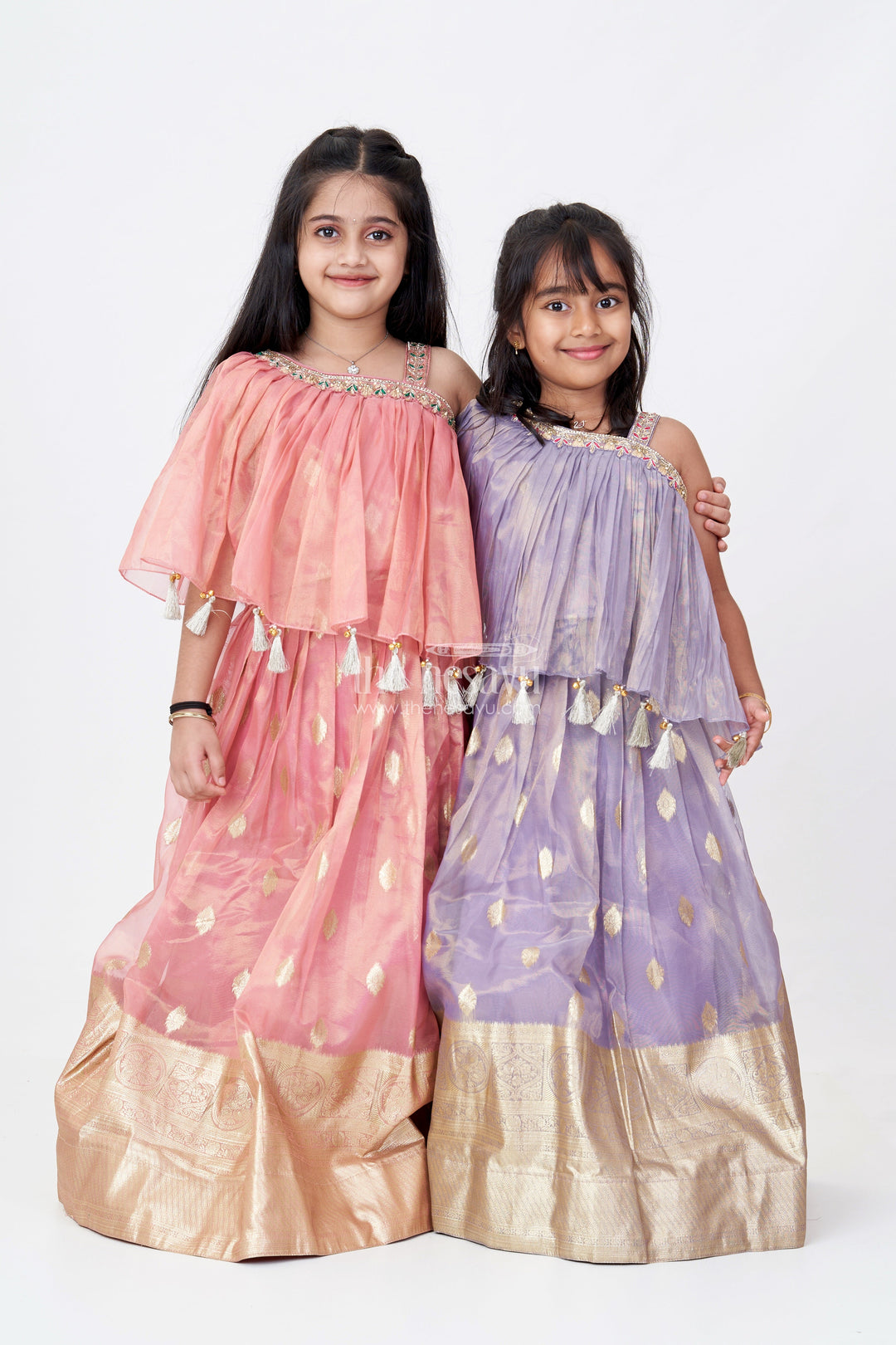 The Nesavu Girls Lehenga Choli Girls Golden Colour Ka Lehenga in Banarasi Kora Tissue Silk with Elegant Zari Border and Off-Shoulder Cape Nesavu Girls Golden Colour Ka Lehenga Banarasi Silk Lavender Tones Cape Choli Design | The Nesavu