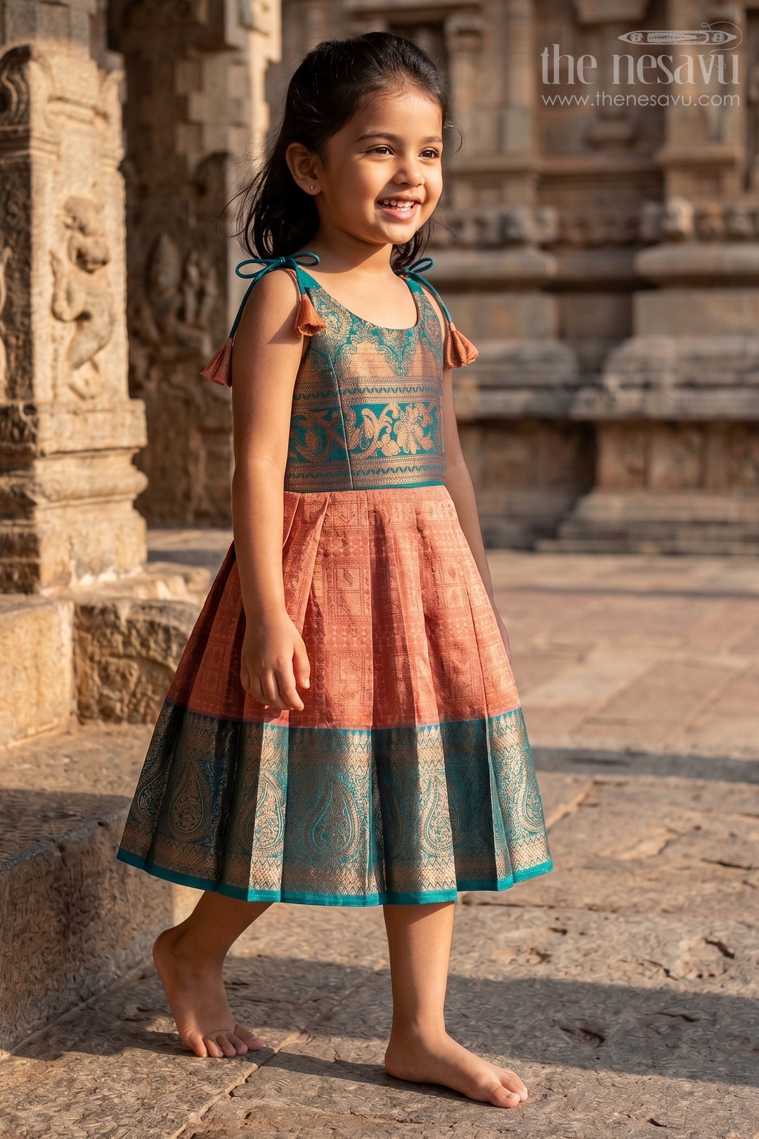 The Nesavu Tie-up Frock Girls Green Dress Silk Frock in Semi Kanchivaram with Tie Up Tassel Straps and Zari Pleated Hem Nesavu Green Dress Silk Frock for Girls in Semi Kanchivaram with Zari Border and Tie Up Tassels | The Nesavu