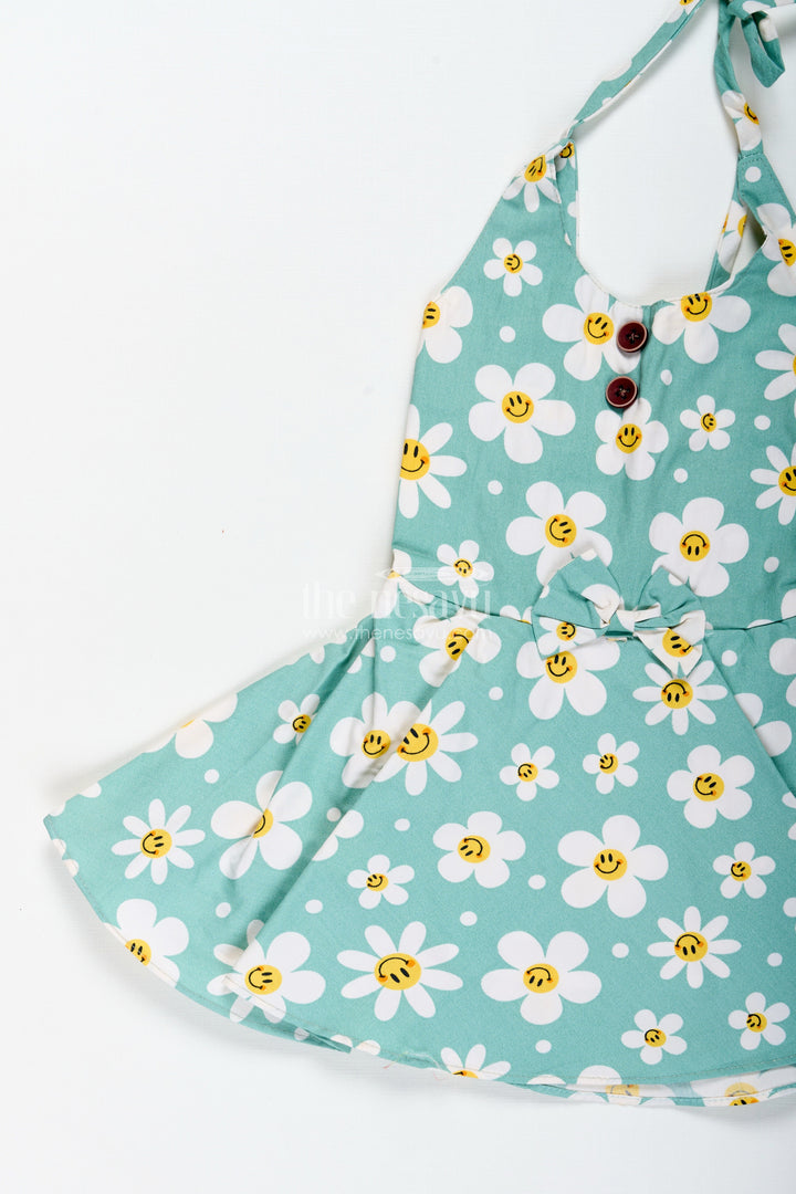 The Nesavu Girls Cotton Frock Girls Green Floral Frock with Smiley Print for Cheerful Summer Twirls Nesavu Nesavu Green Cotton Frock Smiley Floral Print Twirl-Worthy Dress Toddler Girls