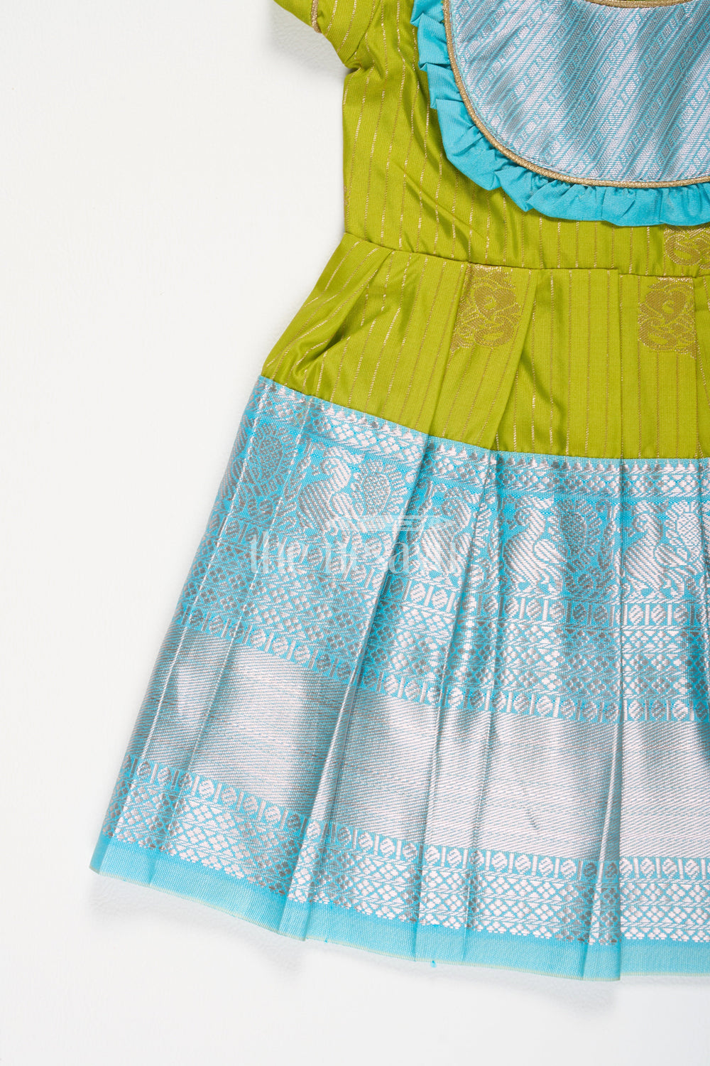 The Nesavu Girls Kanchi Silk Frock Girls Green Kanchipuram Silk Frock with Blue Zari Border and Puff Sleeves Nesavu Nesavu Girls Green Kanchipuram Silk Frock Blue Zari Border Puff Sleeves Festive Occasions