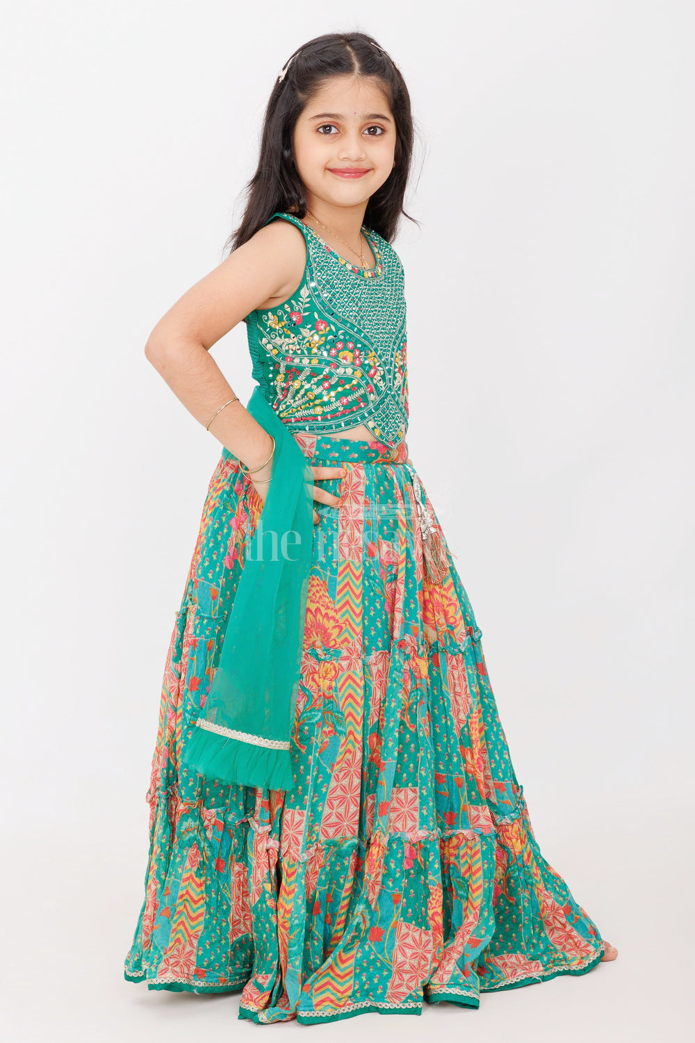 The Nesavu Girls Lehenga Choli Girls Green Pure Georgette Tiered Lehenga Choli with Mirror Detailing and Zigzag Print Nesavu Nesavu Girls Green Georgette Tiered Lehenga Choli Mirror Work Vibrant Zigzag Floral Patterns