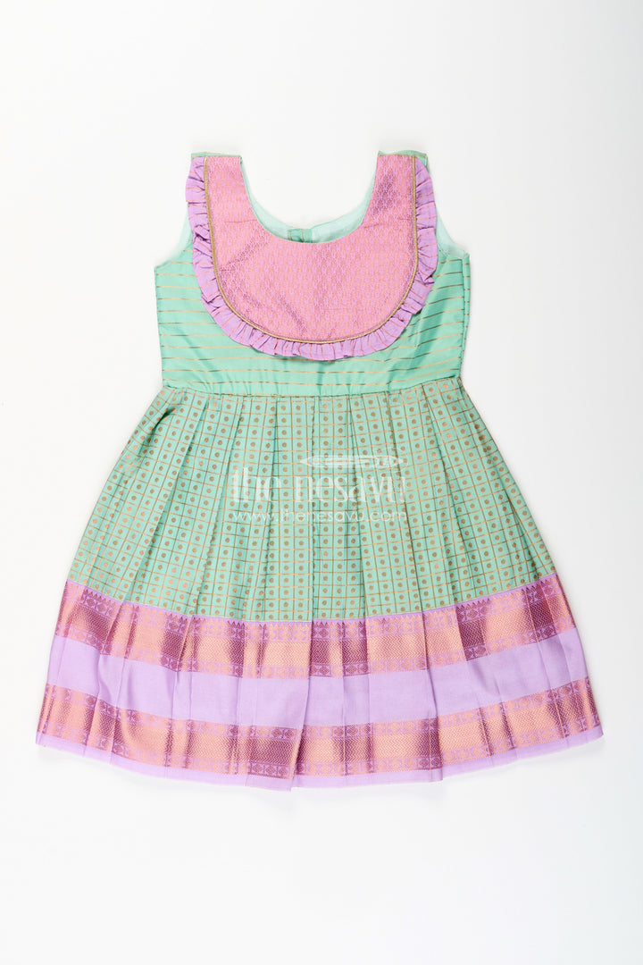 The Nesavu Girls Kanchi Silk Frock Girls green semi Kanchivaram silk frock with lavender border Nesavu 14 (6M) / Green / Style 2 Nesavu girls green semi Kanchivaram silk frock with lavender border and frill yoke