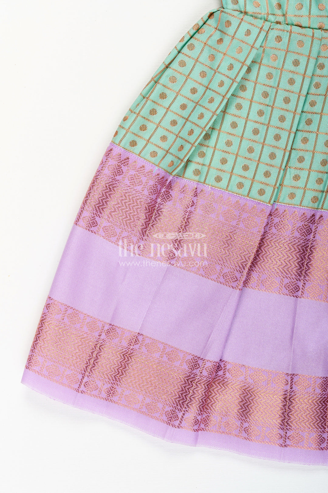 The Nesavu Girls Kanchi Silk Frock Girls Green Semi Kanchivaram Silk Frock with Lavender Border Nesavu Nesavu girls green semi Kanchivaram silk frock with lavender border and frill yoke