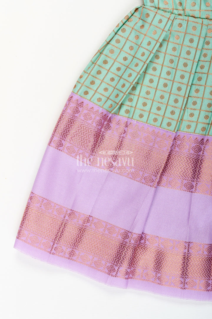 The Nesavu Girls Kanchi Silk Frock Girls Green Semi Kanchivaram Silk Frock with Lavender Border Nesavu Nesavu girls green semi Kanchivaram silk frock with lavender border and frill yoke