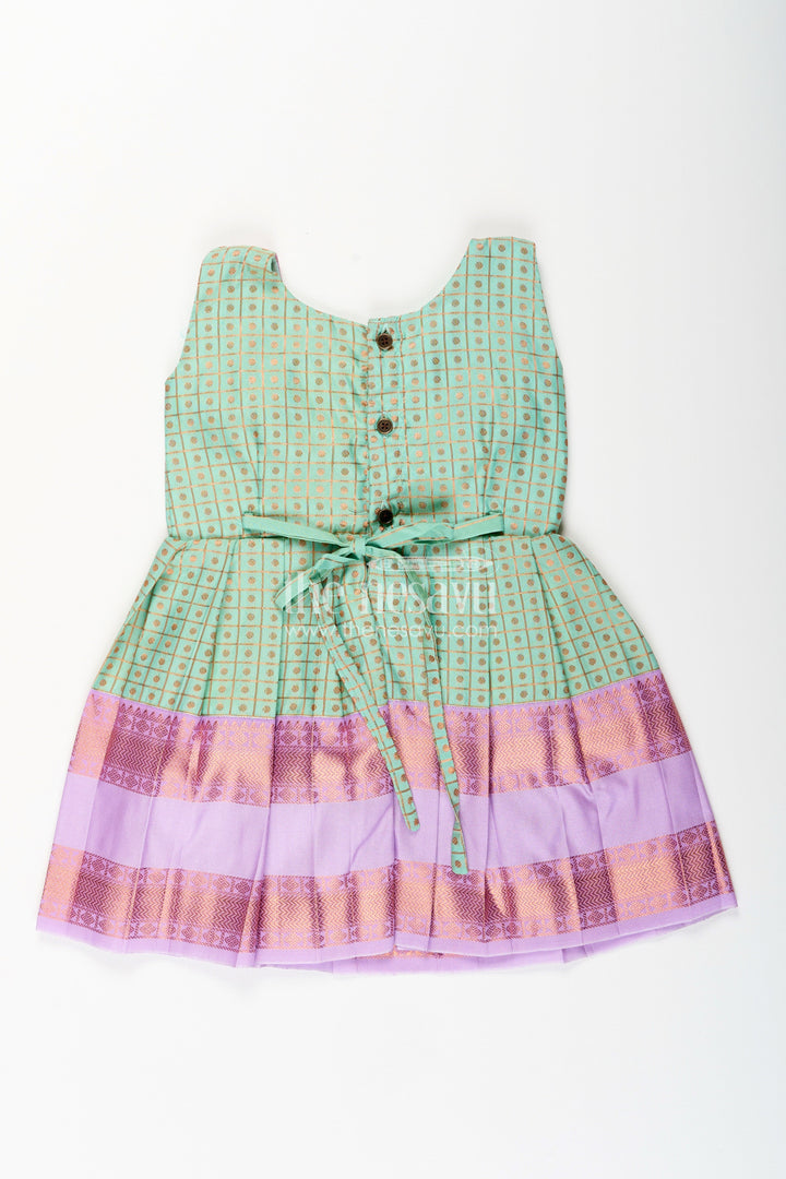 The Nesavu Girls Kanchi Silk Frock Girls Green Semi Kanchivaram Silk Frock with Lavender Border Nesavu Nesavu girls green semi Kanchivaram silk frock with lavender border and frill yoke
