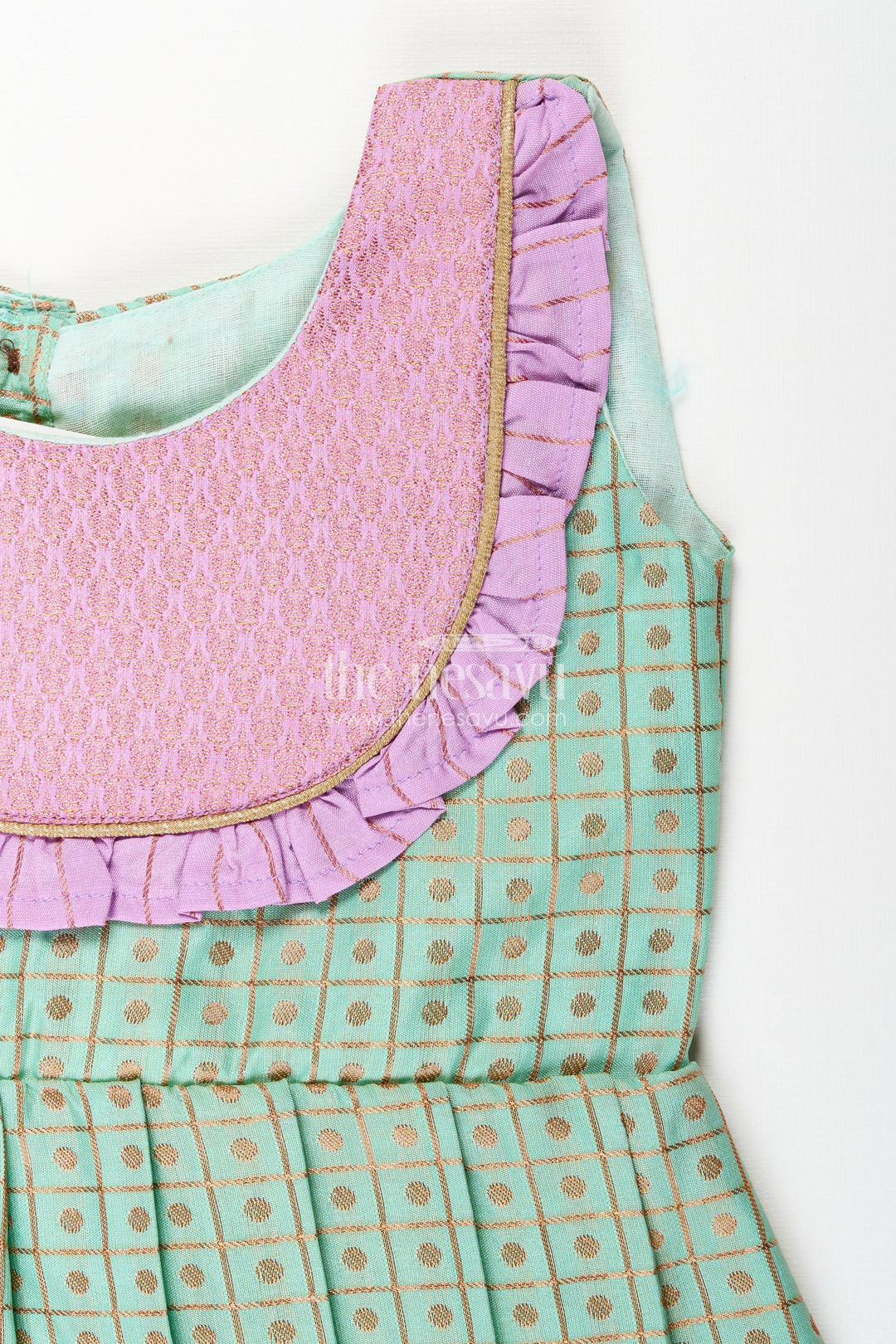 The Nesavu Girls Kanchi Silk Frock Girls Green Semi Kanchivaram Silk Frock with Lavender Border Nesavu Nesavu girls green semi Kanchivaram silk frock with lavender border and frill yoke