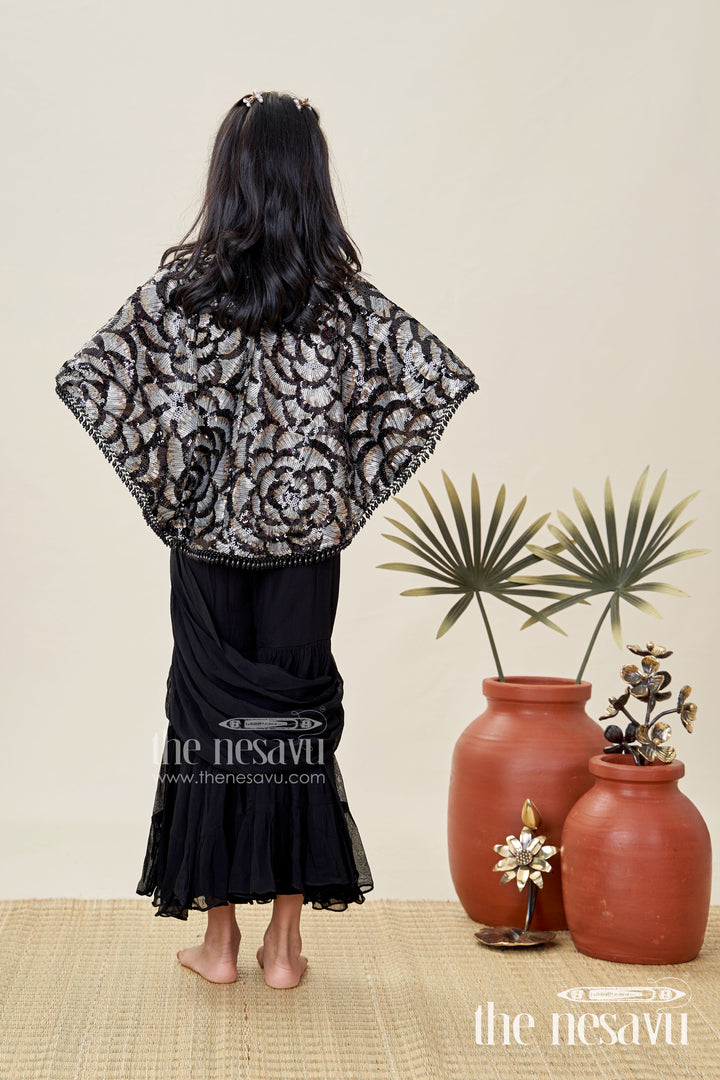 The Nesavu Girls Sharara / Plazo Set Girls Indo Western Sharara Set with Sequin Cape and Crop Top Nesavu Nesavu Black Cape Style Sharara Set Girls Sequin Crop Top Flared Pants