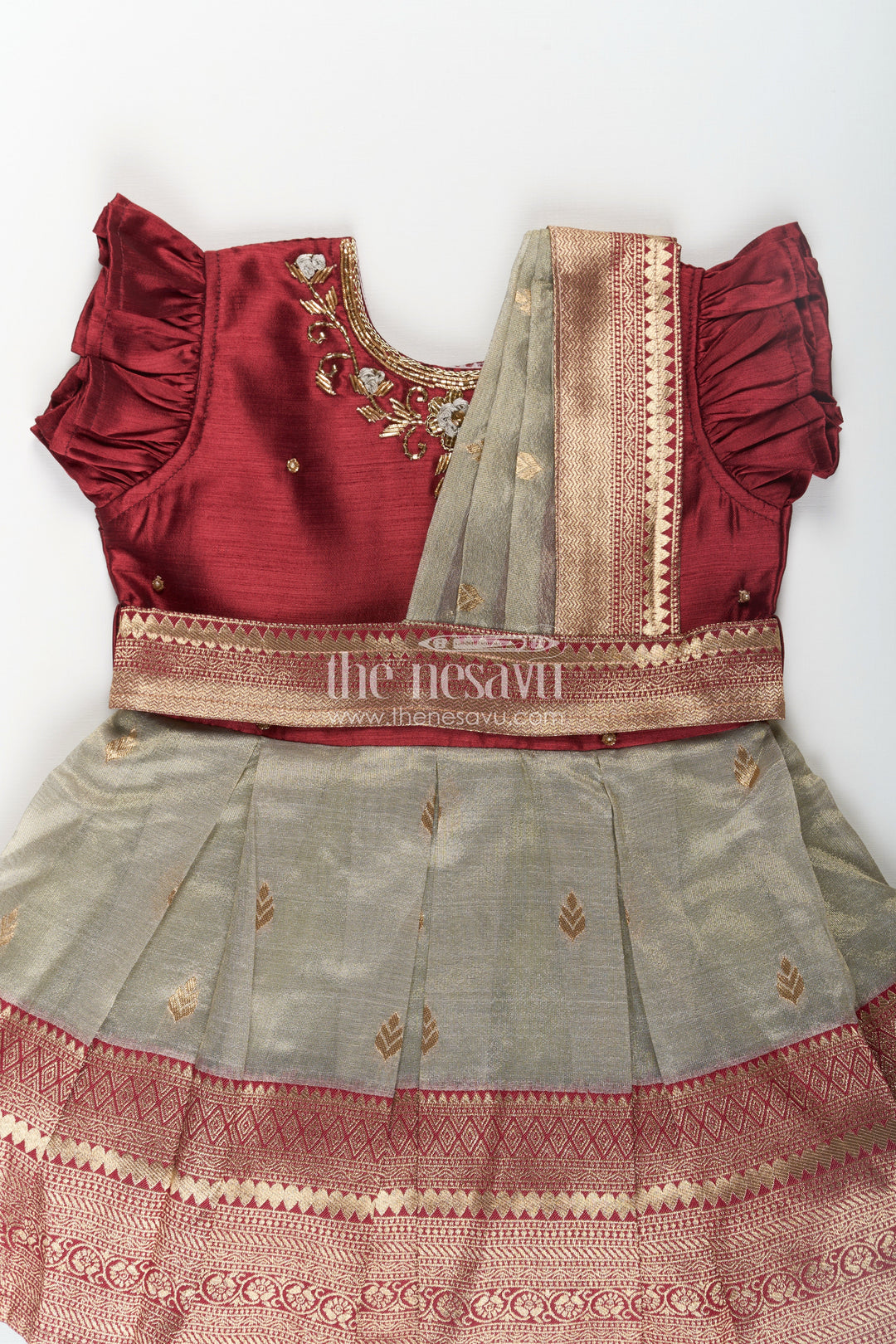 The Nesavu Silk Party Frock Girls Infant Baptism Dress in Maroon and Gold with Pleated Silk Skirt and Puff Sleeves for Graceful Looks Nesavu Girls Silk Infant Baptism Dress Zari Border Puff Sleeves Maroon Gold | The Nesavu