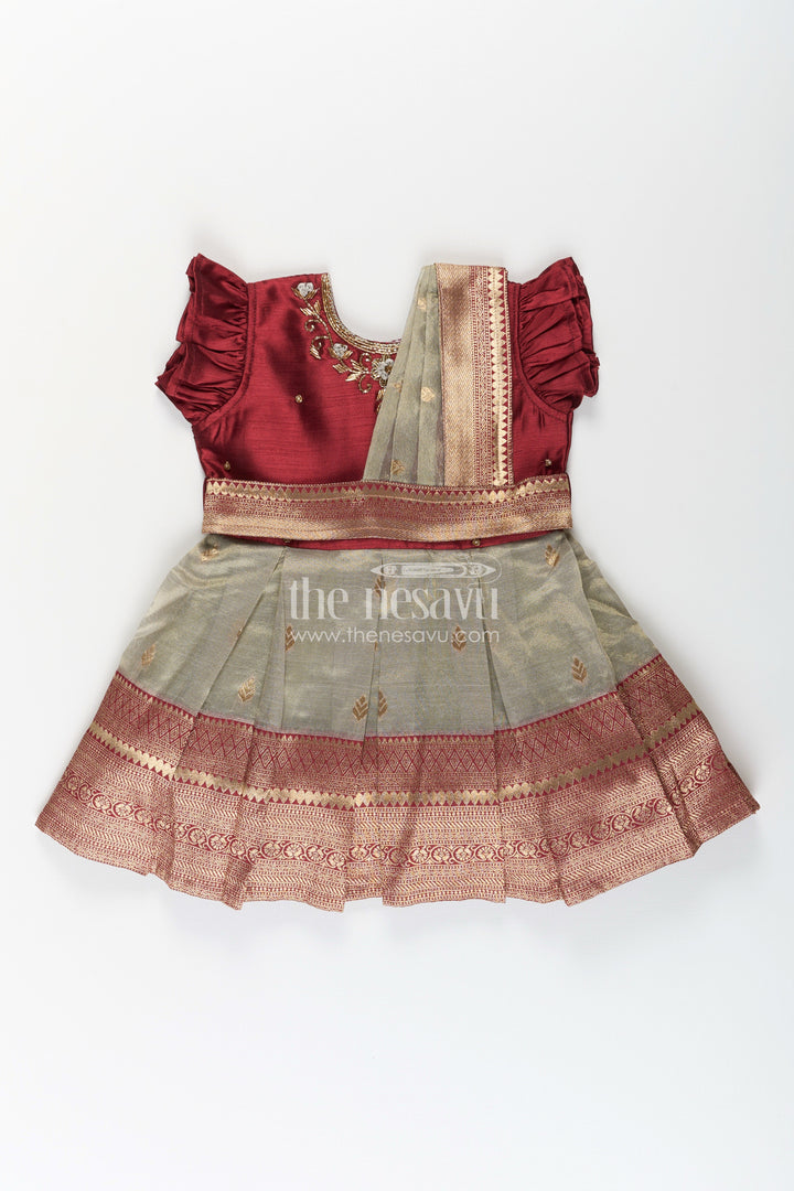 The Nesavu Silk Party Frock Girls Infant Baptism Dress in Maroon and Gold with Pleated Silk Skirt and Puff Sleeves for Graceful Looks Nesavu Girls Silk Infant Baptism Dress Zari Border Puff Sleeves Maroon Gold | The Nesavu